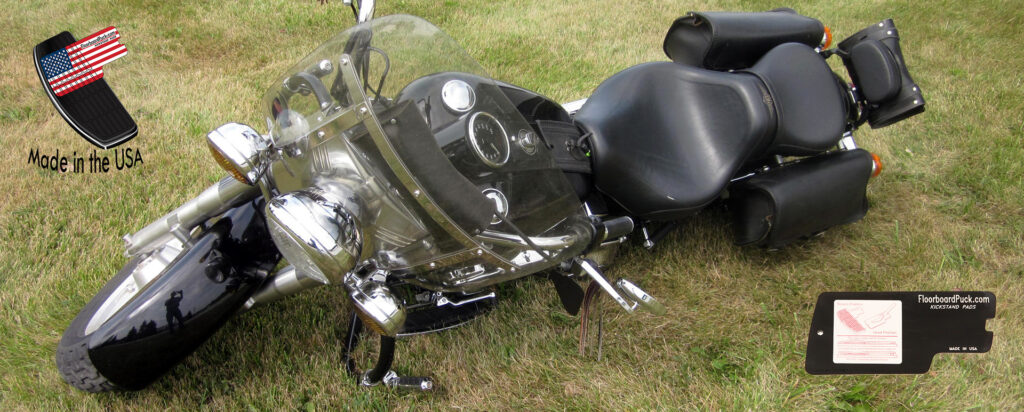 Motorcycle laid over on grass